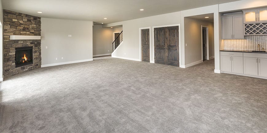 finished remodeled basement with kitchen and carpeting and corner fireplace - Jacksonville IL
